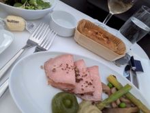 An unreasonable collection of sauces to go with three slices of veal, mushrooms and overcooked asparagus. I believe the red blob was ketchup.

Bread was cold and stale, inedible. 

Salad was decent. 