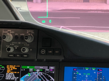 Nav Display with Airport Map Function and view of HUD on a standard day during preflight cockpit prep. 