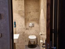 Half bathroom attached to living room.