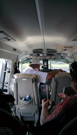 one lucky person actually gets to sit next to the pilot as all 9 seats filled up