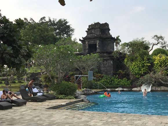 A folly mimicing a temple ruin with water slide 