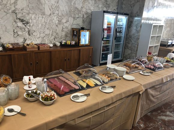 Cold buffet - usual meats, cheeses, sandwiches and wraps, tortilla, cakes and pastries. Also cereals, plus beer, white wine and soft drinks in fridge. 