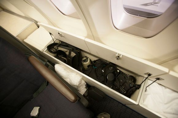 Narrow side area storage bins in upper deck cabin, 2012