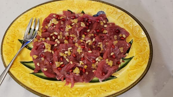 Bluefin tuna crudo with preserved lemon, pomegranate, Aleppo pepper and pine nuts