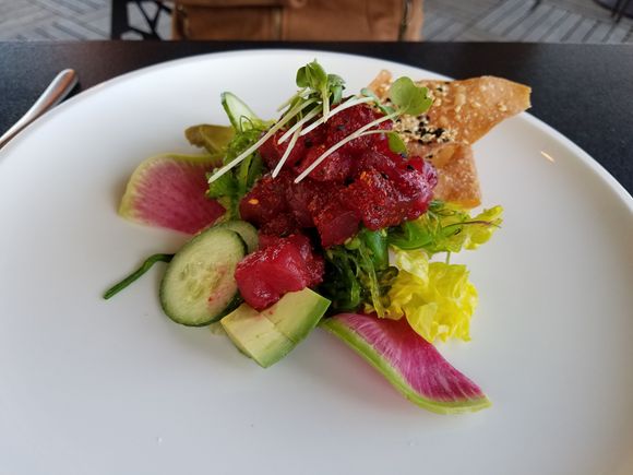 Tuna Poke Salad - nicely spiced tuna, creamy avocado, crisp cucumber, radish, and wonton chips.  Terrific!