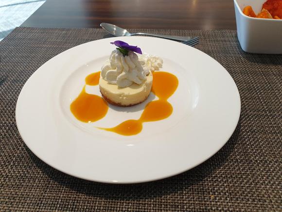 NY Style mini cheesecake with passion fruit reduction