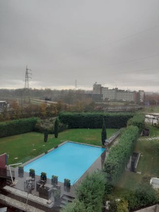 View of the hotel pool from my room  ( raining that morning)