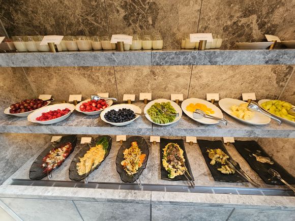 Yogurts, fruits, and various cold salads