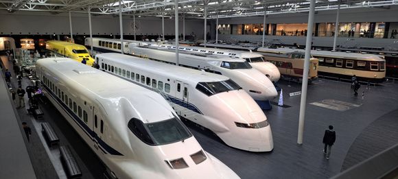 View of the main hall from the 2nd floor walkway ( front car of Dr Yellow track monitoring train visible) . Lots of exhibits in the rooms off the walkway