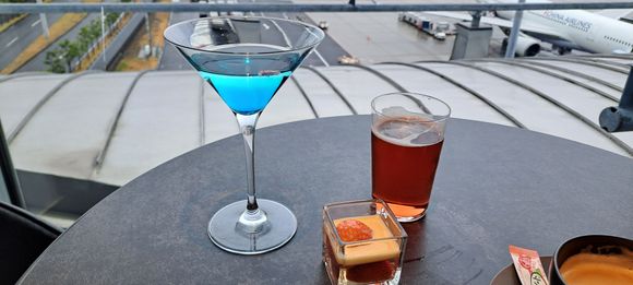 The speciallity blue cocktail and a small dessert