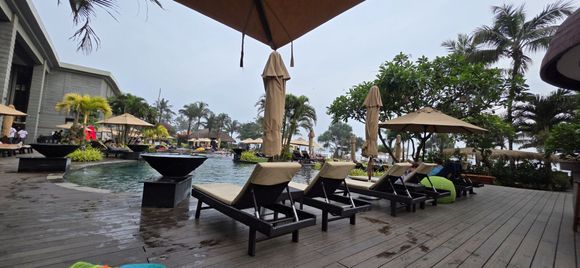 Sitting by the pool bar, looking towards the children's pool area