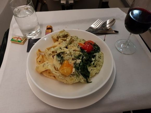 DFW - LHR. CW. Pappardelle tossed in kale pesto with heirloom tomato and wilted baby kale (does not look very appetizing but tasted pretty good)