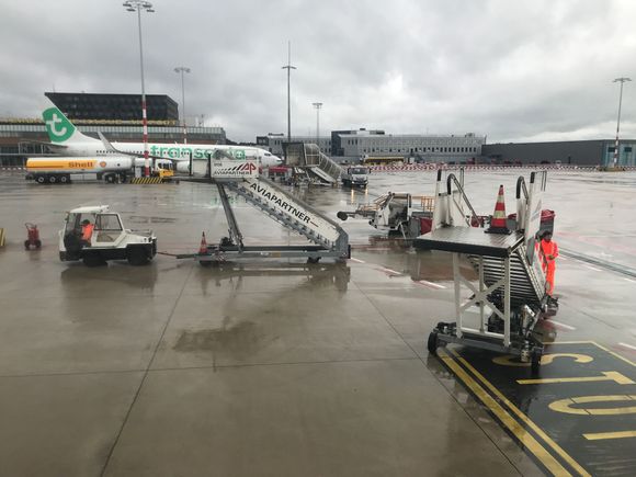 Disembarking the aircraft will be via uncovered stairs,
(There are covered stairs but these were in use by a Transavia flight who arrived just before us)