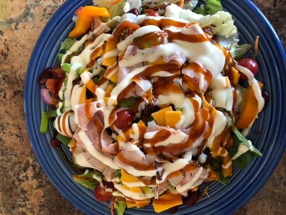 For lunch, leftover Lou Malnati salad. I added Black Forest ham, cheddar, green and orange pepper slices (for Corky), avocado (for kipper), cherry tomatoes, a handful of kidney beans and Ranch and Western dressings. 
