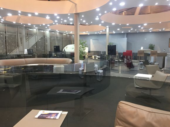Lounge at reception end. Toilets (clean and new) contained within lounge. Wine station with limited sprits shown on the left. 