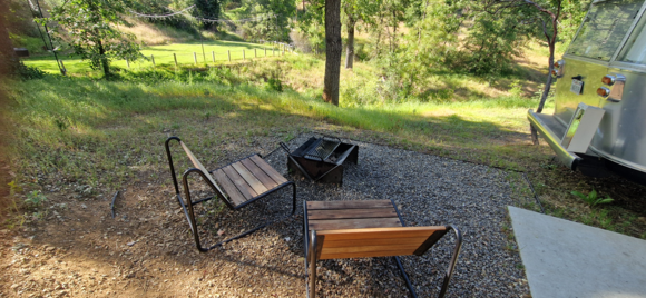 Each site also came with a BBQ grill, and the Airstream kitchen was stocked with the necessary tools for grilling, along with tableware for four people. However, the fire ring at my site didn’t offer much privacy—though that likely varies depending on the location of your site.