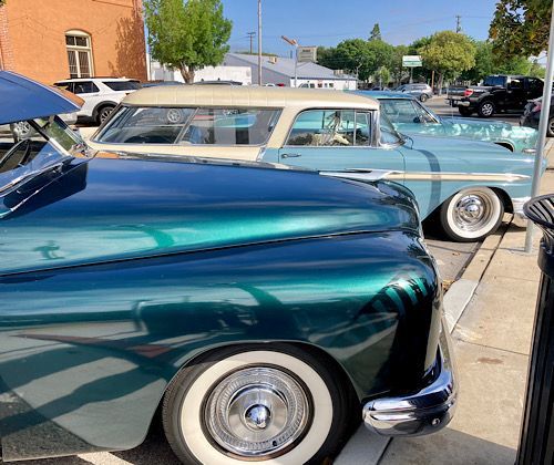 Three custom cars. My dad’s is the blue and white one. 