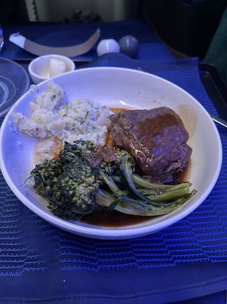 seared short rib with green peppercorn sauce. fork tender and very tasty. the sauce was more salty like soy sauce than peppery. broccolini had a good smoky flavor from being grilled.