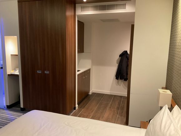 View from bed towards the kitchenette and room entrance 