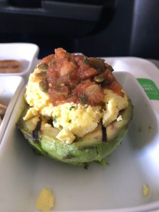 Grilled & chilled avocado - warm scrambled eggs and pepita salsa