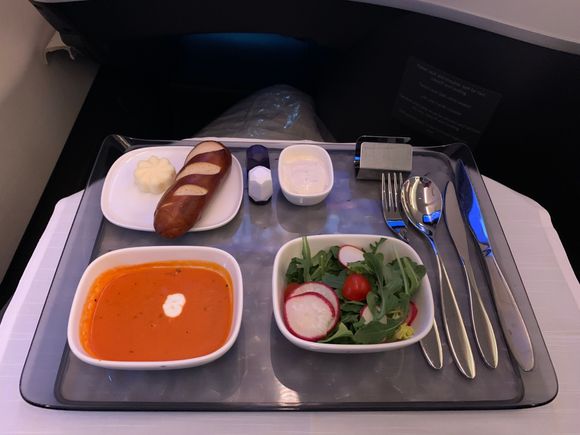 The crew decided to serve the soup and salad first instead of everything on one tray...