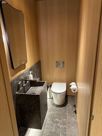 The suite also includes a guest powder room in the entryway.
