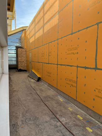 East from corner, only an emergency exit door at the end.  Not attached to terminal at this point.