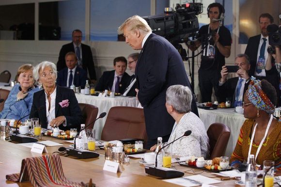 AP grabbed this shot of Trump walking in late to the gender equality breakfast at the G7 summit