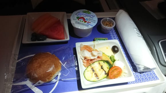 Before landing: prosciutto with manchego cheese and grilled zucchini. Fresh fruit salad. Greek yoghurt with granola.