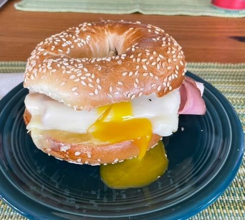 Ham, egg and cheese breakfast sandwich on a Chompie’s sesame seed bagel 