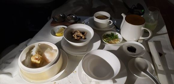Chicken and shimeji mushroom congee with dim sum selection - har gow, chive dumpling, siu mai