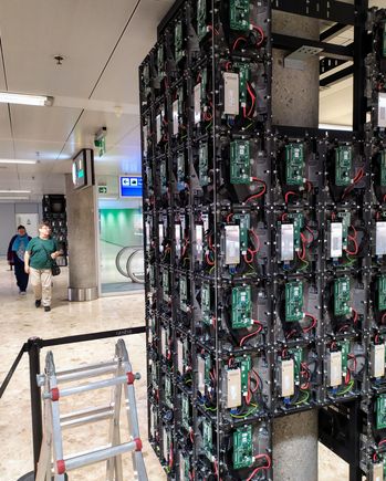 When I reached Geneva airport, a workman had opened up the panels on one of the pillars, revealing the interior - I got him to use his magic screwdriver to tighten the screws on my case!