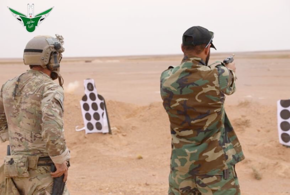 A member of the MaghaweirThowra faction and a member of the United States Special Forces Unit at  al-Tanf base.