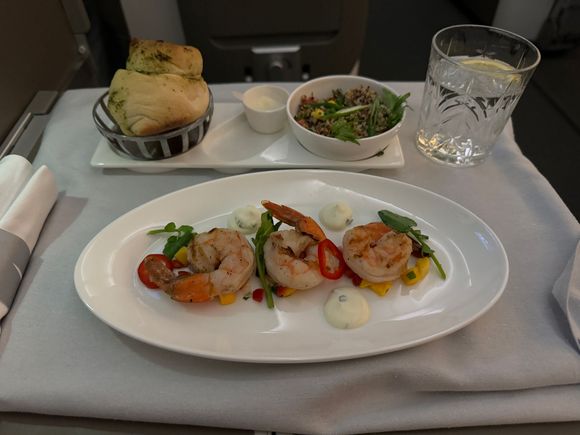 Quinoa salad was fine but needed brightening. I asked for a slice of lemon to squeeze a couple of drops into the salad which improved it. Prawns very pleasant