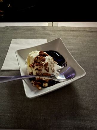Ice cream with fudge and nuts in square dish, unsure if this route would typically have the full Flagship sundae