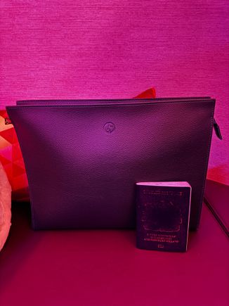 MacBook sized amenity kit with Georgio Armani pyjamas in F (passport for scale)
