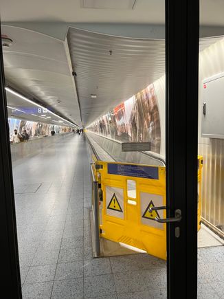 Entire length of tunnel travelators out of action B to A 
