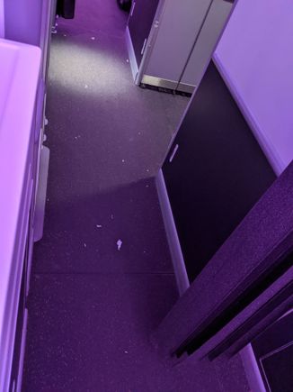 Outside BP/PE bathroom on YVR-AKL Feb 28th.
Paper towel residue tracked outside the bathroom.