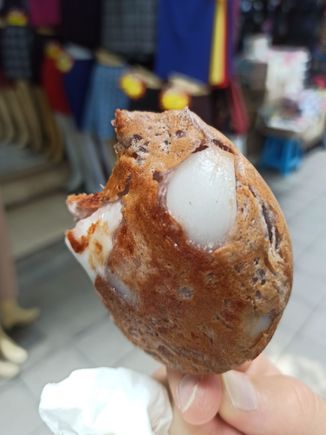 "ba bin," aka a grilled crunchy creamy coconut pastry