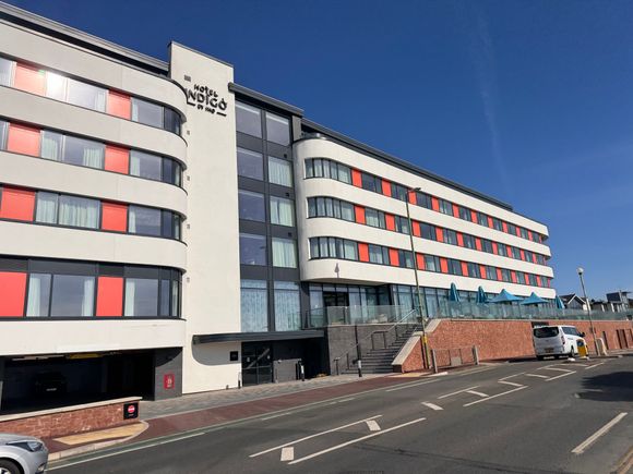 Front of hotel. Parking to the left; reception up the stairs 