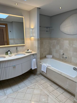 Bathtub and two sinks