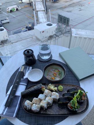 Sushi selection including California roll, spicy tuna roll and the hand roll (with unagi)