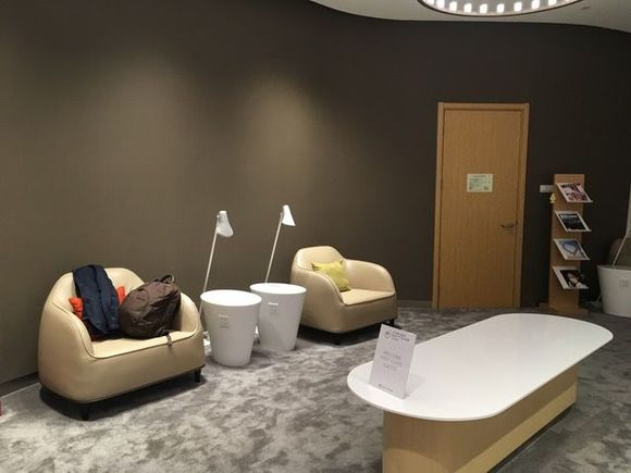 A door at the back that leads to the business lounge toilets