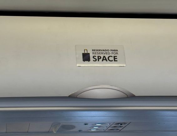 Overhead locker space only for the passengers booked in the emergency exit rows and rigorously policed by the cabin crew - wish that British Airways would do this.