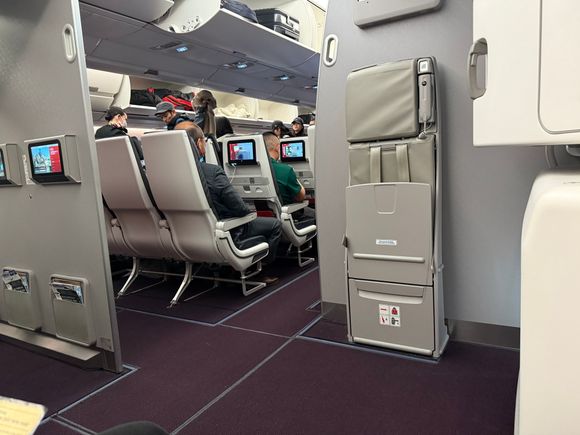 Now we’re finally on the way! First time in an A350, weird for me to see such a large aircraft on a “domestic” trip. We grabbed the exit row seats, but I wish I took the aisle, as there is an annoying curve on the window side which reduces seat floor area. 