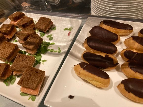 Salmon sandwiches and éclair sweets