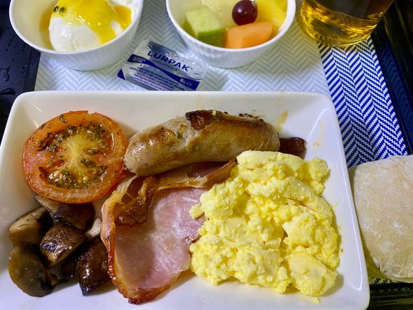 Scrambled egg, bacon, sausage, mushrooms, tomato