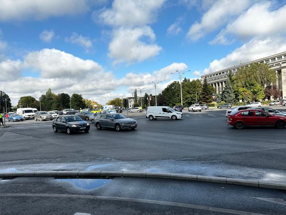 Crazy enormouse road junction, goes all the way back to the trees. At least 20 lanes join the huge expanse and it always has a few carloads of whistle happy police managing it