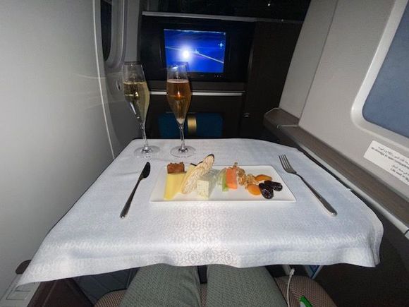 Cheese plate, white wine and champagne after take off