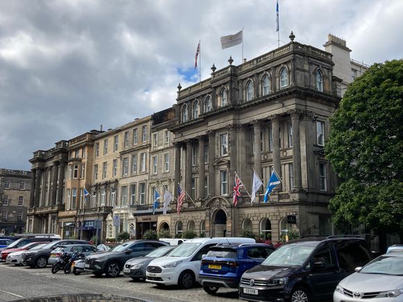 The hotel consists of multiple connected building : the right pillared building is the main entrance with reception and the lobby